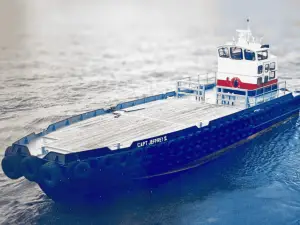 A flat-decked barge named "CAPT. JEFFRE I" is floating on calm water; the vessel has a control cabin and rubber bumpers along its sides.